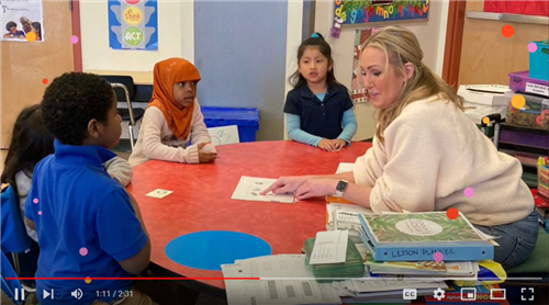 Ms. SKye Hanna with kindergarten students 